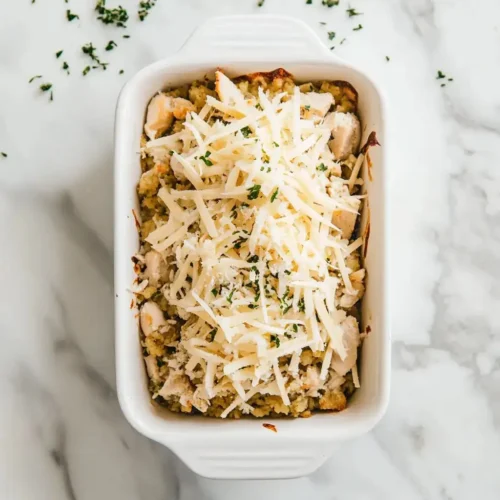 Dolly's Chicken And Stuffing Casserole: Comforting And Quick Recipe Dolly's Chicken And Stuffing Casserole ready to bake in a white ceramic dish