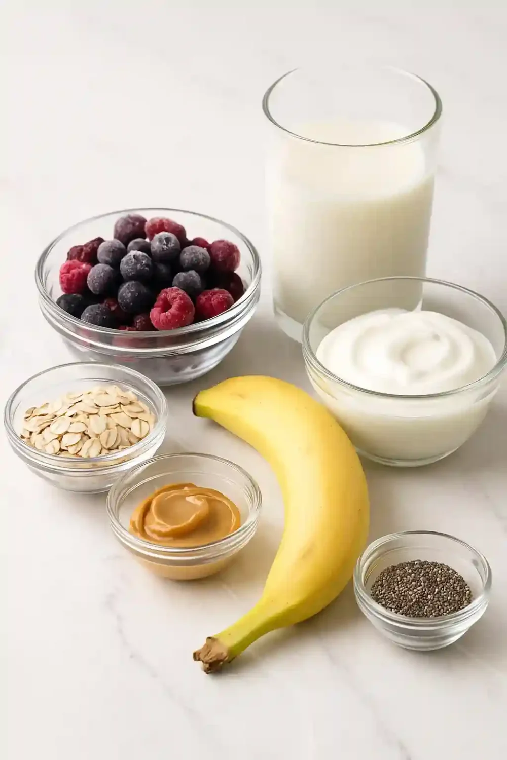 How to make a smoothie with clean glass bowls of fruit and yogurt