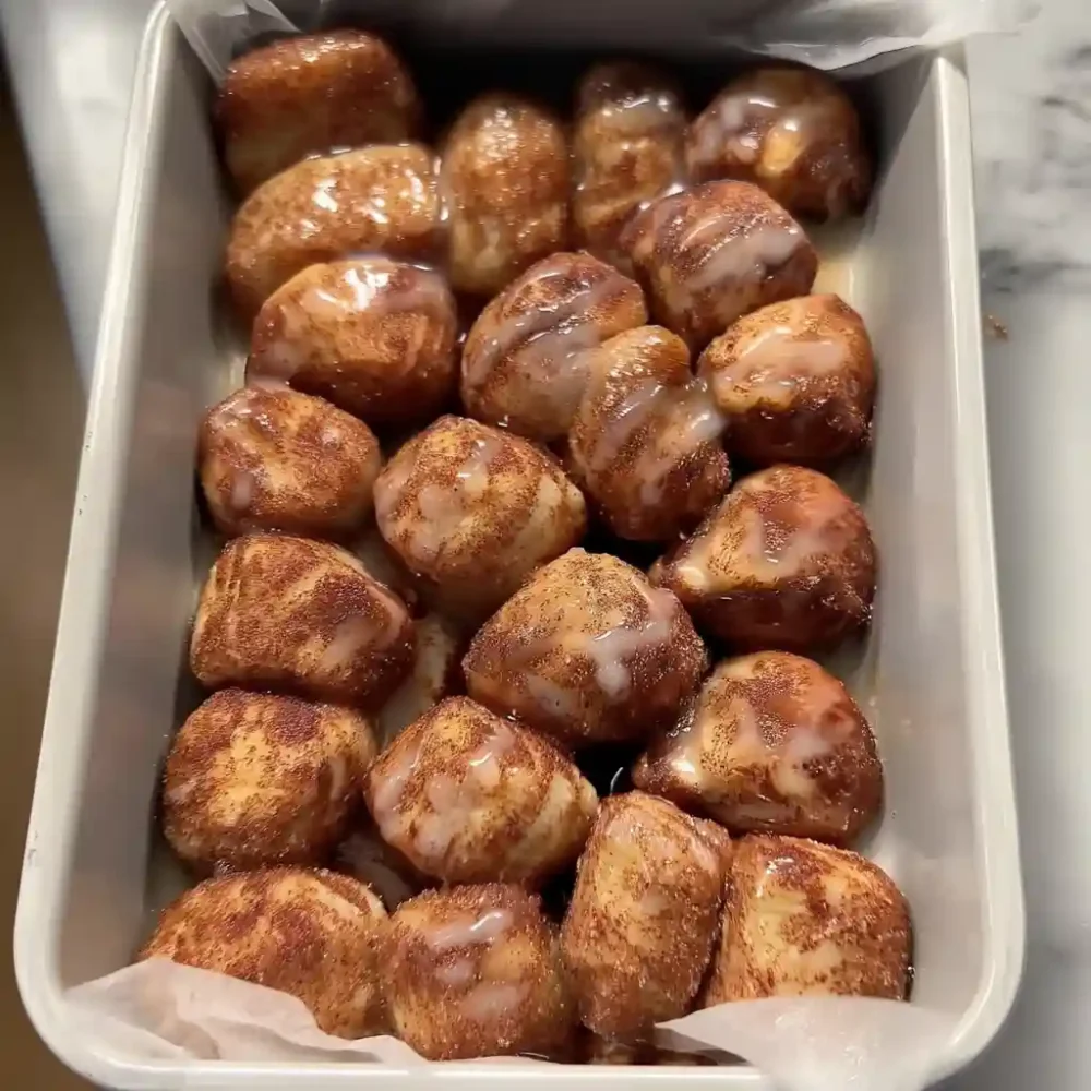 Quick and easy cinnamon roll bites glazed and served warm from the pan