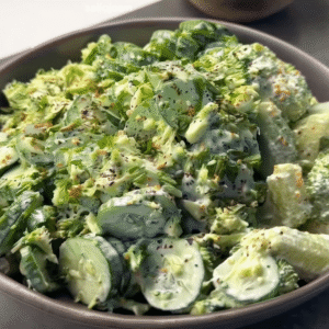 Creamy Cucumber Avocado Broccoli Salad – 5 Minute Recipe for Fresh Flavor Bowl of creamy cucumber avocado broccoli salad with sliced cucumbers, chopped broccoli, and herb dressing.