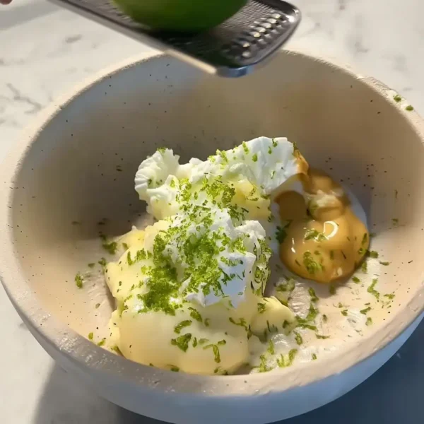 Creamy Cucumber Avocado Broccoli Salad – 5 Minute Recipe for Fresh Flavor Creamy cucumber avocado broccoli salad dressing with lime zest on top