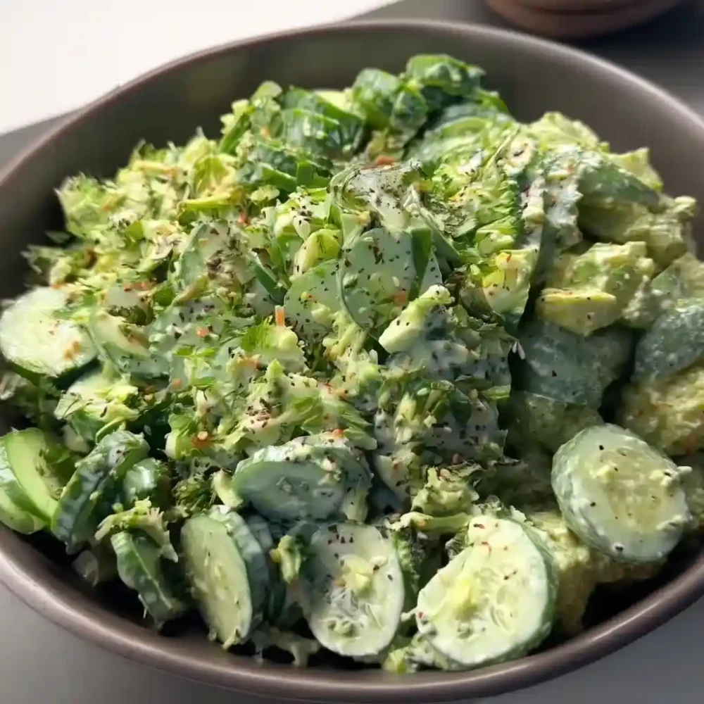 Creamy Cucumber Avocado Broccoli Salad – 5 Minute Recipe for Fresh Flavor Creamy cucumber avocado broccoli salad served in dark ceramic plate