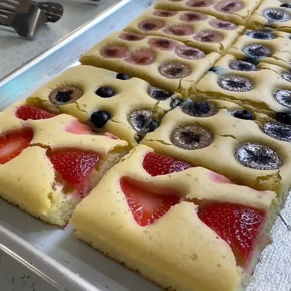 Sheet pan pancakes fresh out of the oven, golden and fluffy