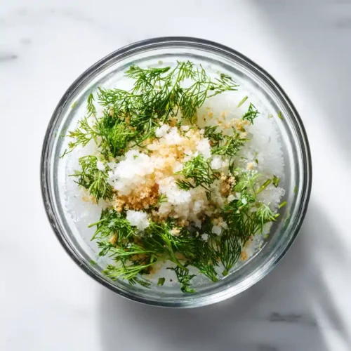 Hot Smoked Trout: How to Smoke Trout at Home for Maximum Flavor Smoked trout brine coming together with dill, garlic, and coarse salt