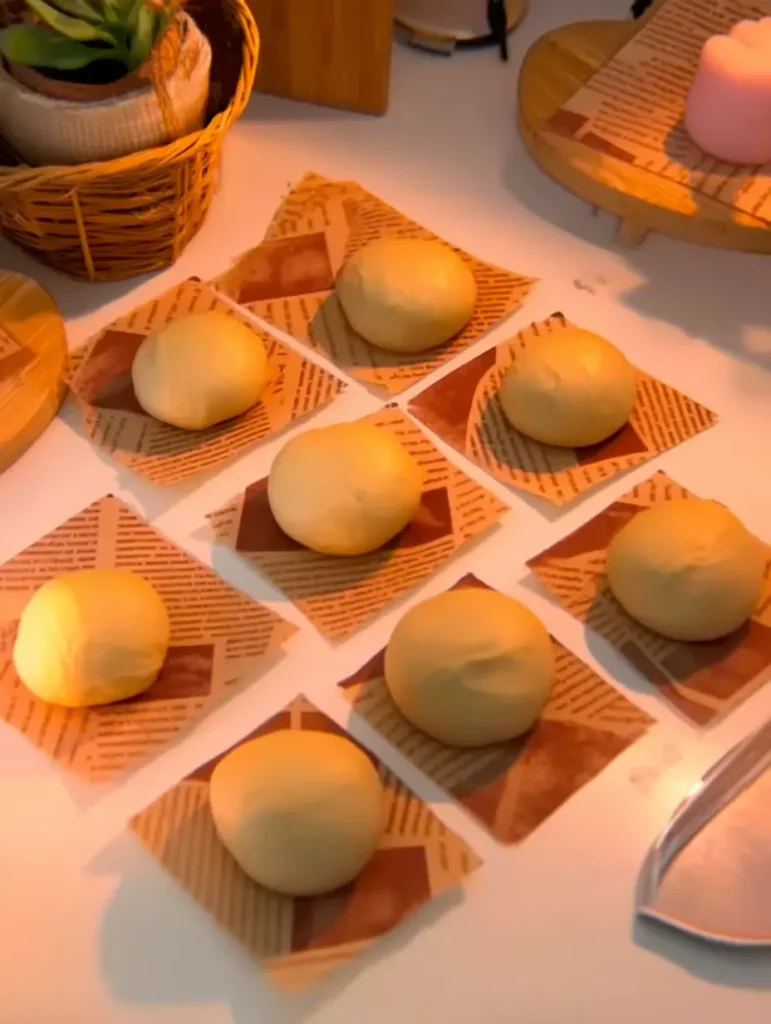 Chocolate Bomboloni – Italian Cream-Filled Delight Chocolate Bomboloni dough proofed and ready to fry