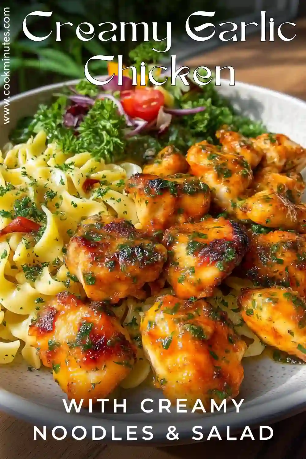 Garlic Butter Chicken Bites with Creamy Noodles garlic butter chicken bites with creamy noodles and fresh green salad in a bowl