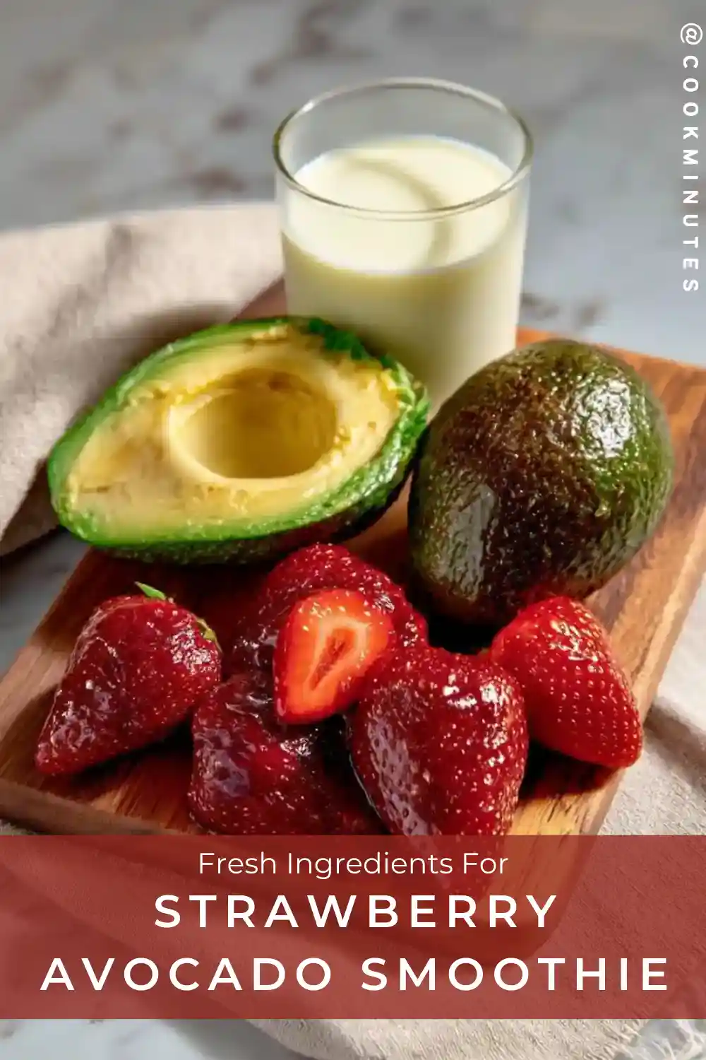 Strawberry Avocado Smoothie: Creamy & Nutritious in 5 Minutes Fresh strawberries, halved avocado, and a glass of almond milk on a wooden cutting board