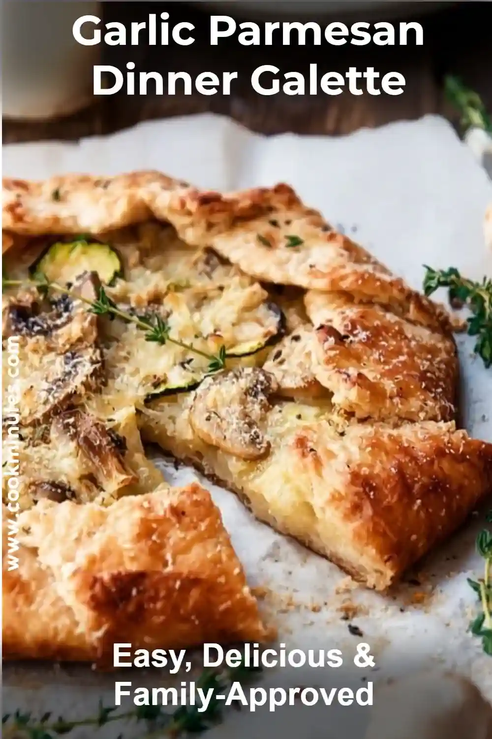 Garlic Parmesan Dinner Galette With Zucchini & Mushrooms Garlic parmesan dinner galette with golden crust, mushrooms, zucchini, and herbs on a plate.