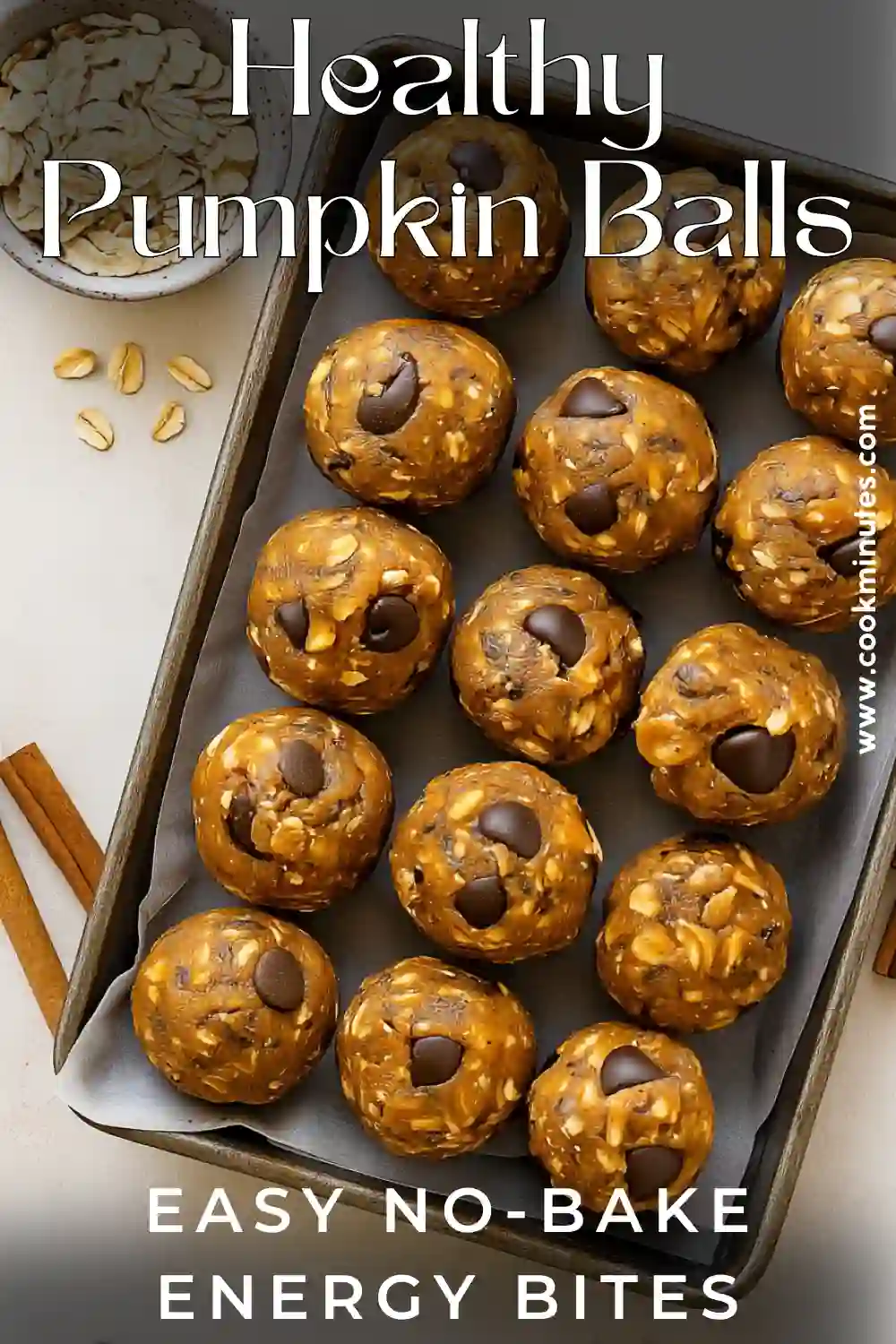 Pumpkin Protein Balls – A Cozy No-Bake Fall Snack Healthy pumpkin protein balls with oats and chocolate chips on parchment tray