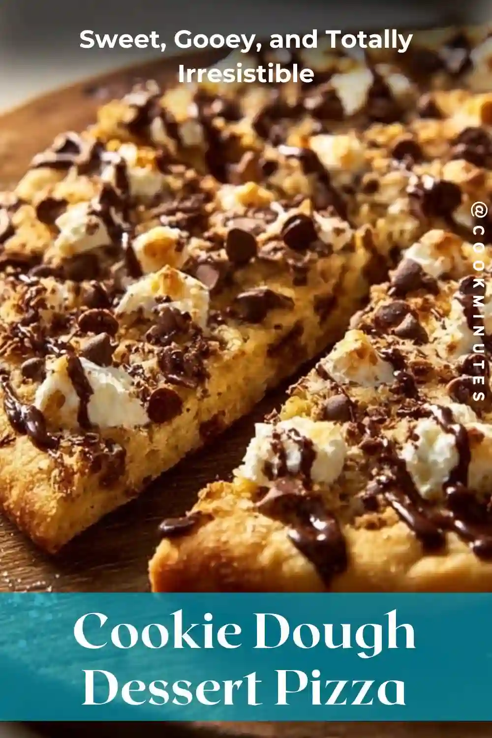 Cookie Dough Dessert Pizza topped with chocolate chips and glaze on a wooden board.