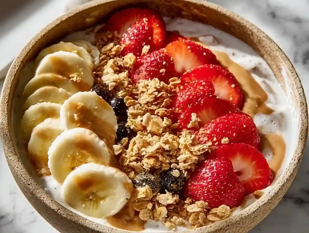 High-Protein Greek Yogurt Bowl: A Delicious Way to Start Your Day High-protein Greek yogurt bowl topped with fruits and nuts for a healthy breakfast.