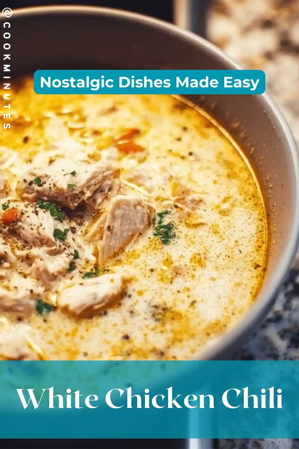 White Chicken Chili served in a bowl garnished with cilantro and sour cream.