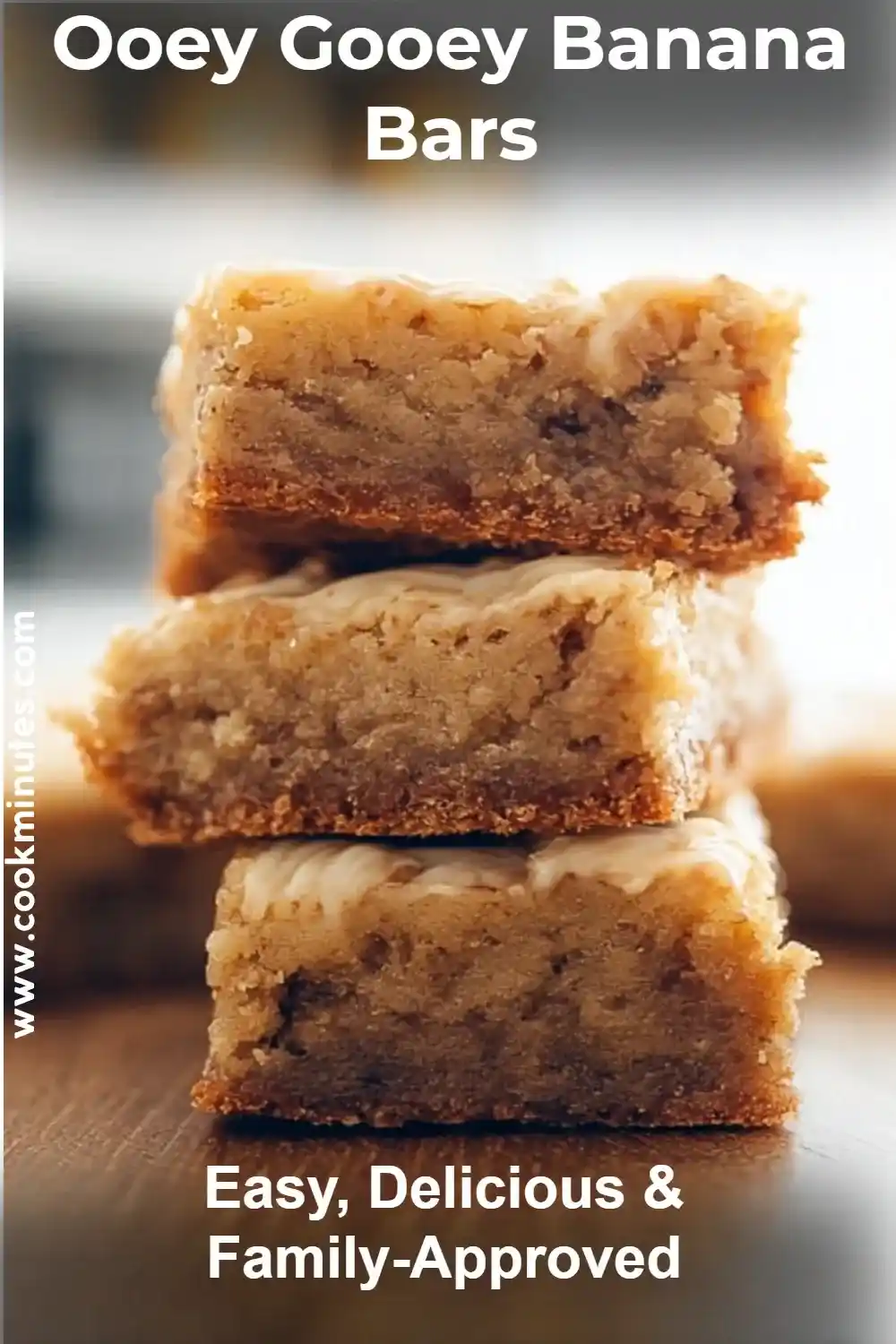 Banana Bars with salted caramel frosting, stacked and glowing with a gooey texture.