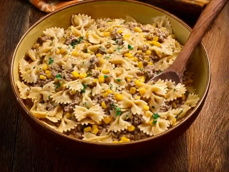 Creamy ranch beef pasta dish with herbs and spices in a bowl.