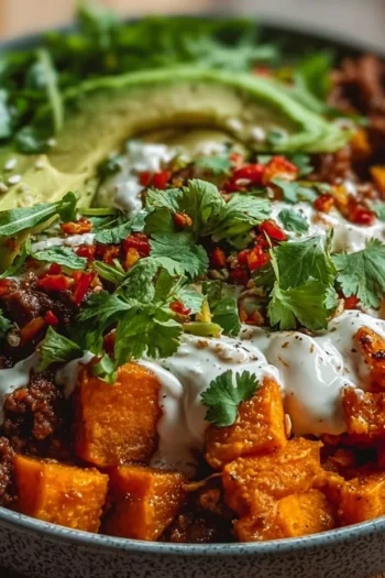 “This Sweet Potato Taco Bowl is a burst of flavors and a celebration of textures.” sweet potato taco bowl