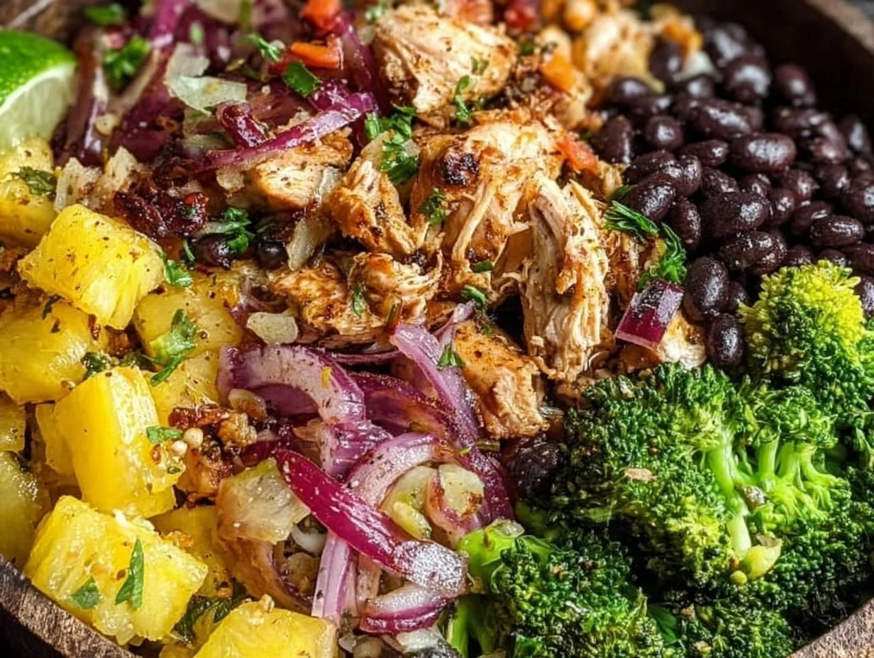 Pineapple Jerk Chicken Bowl topped with fresh herbs and pineapple slices