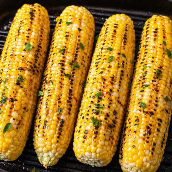 Perfectly grilled corn on the cob with butter and seasonings