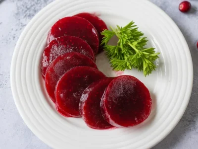 Homemade cranberry sauce with gelatin served on a festive table.