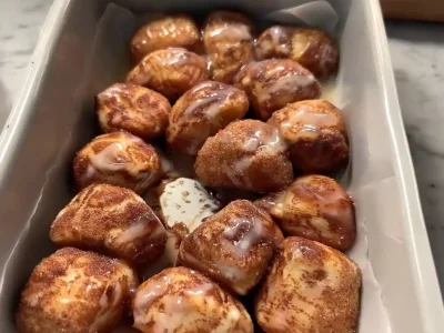 Quick and easy cinnamon roll bites glazed and served warm from the pan