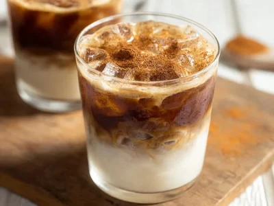 Creamy Apple Crisp Macchiato topped with cinnamon and apple slices