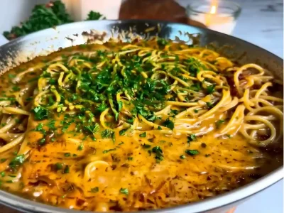 Caramelized onion and garlic spaghetti in golden creamy sauce,