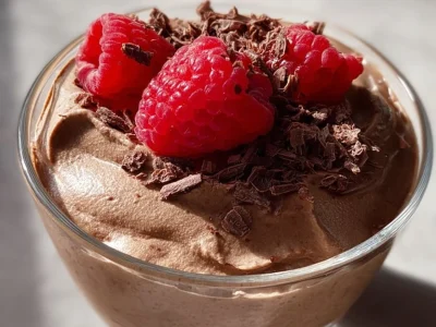 Creamy and rich Chocolate Protein Mousse in a bowl topped with chocolate shavings.