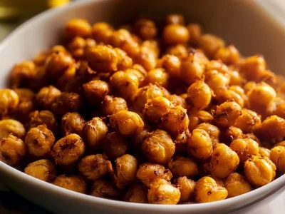 A bowl of crunchy roasted chickpeas seasoned with spices.