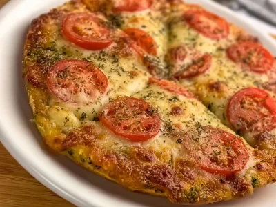 Healthy broccoli pizza topped with fresh vegetables and cheese