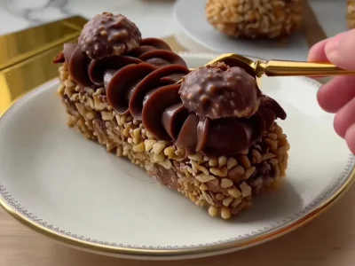 Cream-topped No Bake Ferrero Rocher-copycat Desserts with hazelnut coating
