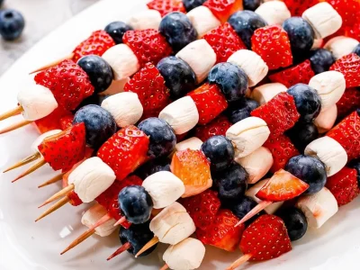 Fresh Red White and Blue Fruit Skewers with strawberries, blueberries, and watermelon.