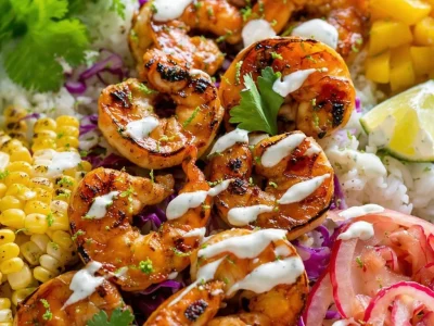 A colorful Easy Shrimp Taco Bowl with shrimp, rice, avocado, and slaw.
