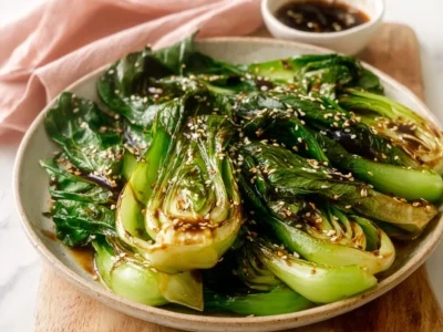 Sautéed baby bok choy with ginger sauce served on a plate