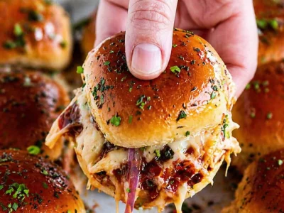 BBQ Chicken Sliders topped with cheese on sweet Hawaiian rolls