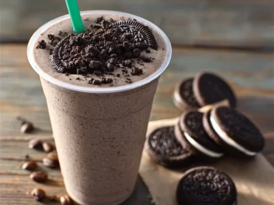 Starbucks-inspired Oreo Frappuccino topped with whipped cream and crushed Oreos