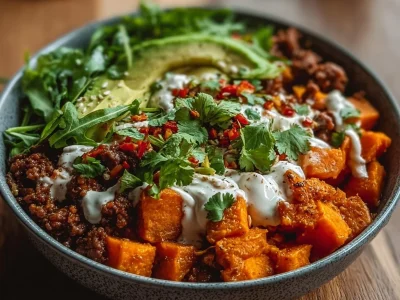 A colorful Sweet Potato Taco Bowl with fresh veggies and toppings